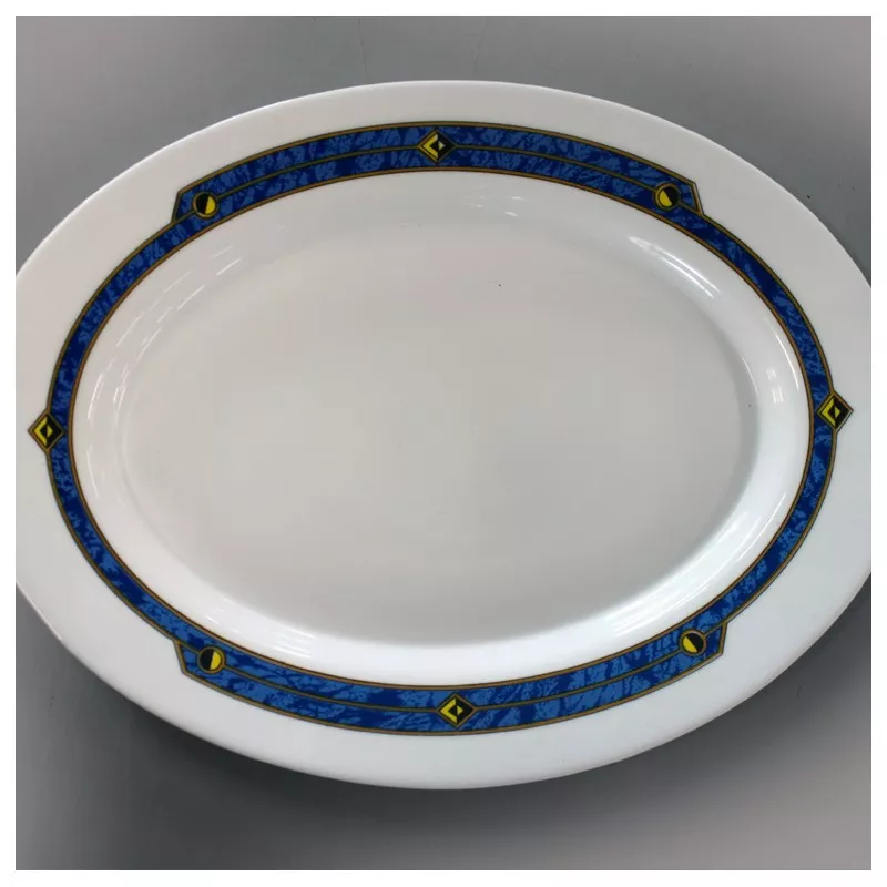 FUENTE OVAL 22 HARMONIA ASTRAL porcelana blanca con borde azul decorativo y detalles en amarillo.