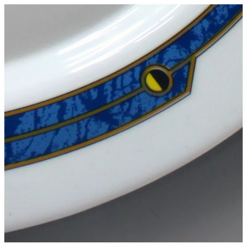 Fuente oval 22 Harmonia Astral de cerámica blanca con diseño azul y amarillo, acabado brillante y decoraciones elegantes.