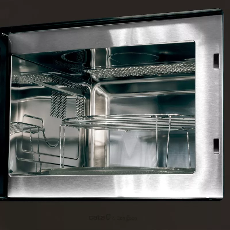 MICROONDAS CATA MC 25D de acero inoxidable con diseño compacto y vidrio templado en la puerta, fácil de limpiar.